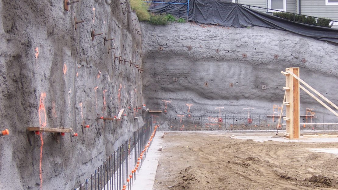 vertical earth wall held in place with shotcrete and soil nails